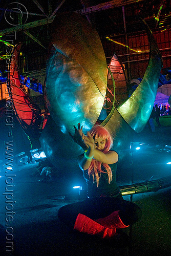 serpent mother's egg - giant snake skeleton animated sculpture - opulent temple massive rave party (treasure island, san francisco), art installation, egg, night, opulent temple, pink wig, sculpture, serpent mother, skeleton, snake, woman