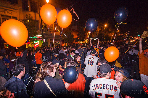 sf giants fans celebrating, 2012 world series, balloons, baseball fans, celebrating, crowd, editorial, go giants, night, partying, sf giants, sports fans, street party