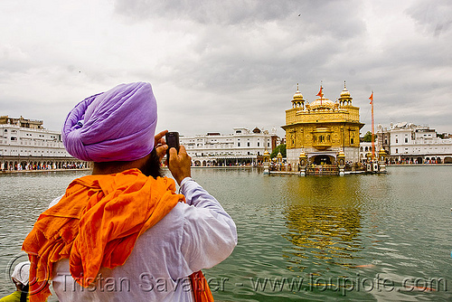 sikh man taking picture of golden temple - amritsar (india), amritsar, cellphone, golden temple, gurdwara, headdress, headwear, punjab, sikh man, sikhism, tourist, turban