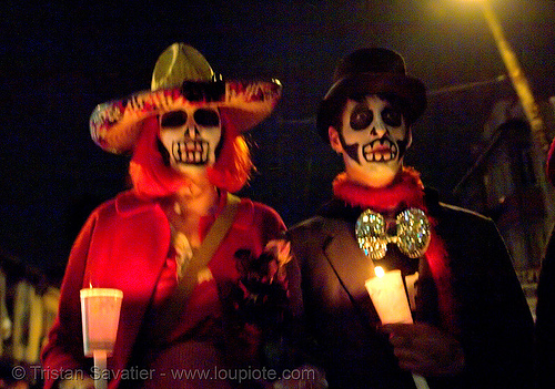 skull makeup - couple with candles - dia de los muertos - halloween (san francisco), candlelight vigil, candles, costumes, day of the dead, dia de los muertos, face painting, facepaint, halloween, night, sugar skull makeup