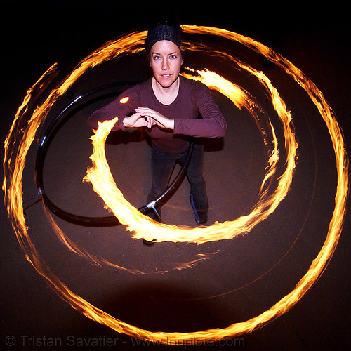 spinning a fire hula hoop (san francisco), fire dancer, fire dancing, fire hula hoop, fire performer, fire spinning, hula hooping, night, spinning fire