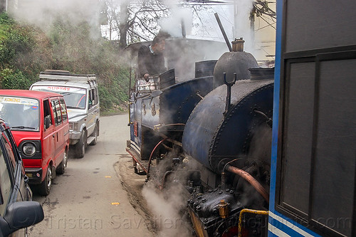 steam train sharing the road with cars - darjeeling (india), 788 tusker, cars, darjeeling himalayan railway, darjeeling toy train, man, narrow gauge, operator, railroad, road, smoke, smoking, steam engine, steam locomotive, steam train engine, train car