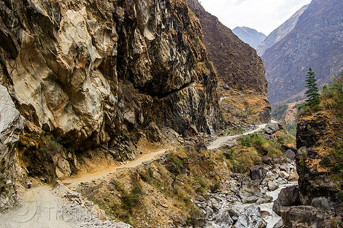 steep valley between tatopani and jomsom (nepal), annapurnas, cliff, dirt road, kali gandaki river, kali gandaki valley, motorcycle touring, mountain river, mountain road, mountains, stream, unpaved