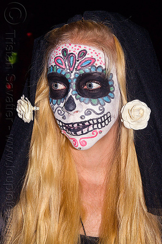 sugar skull makeup and white flowers in blond hair, blond hair, blonde, day of the dead, dia de los muertos, face painting, facepaint, halloween, long hair, night, sugar skull makeup, white flowers, woman