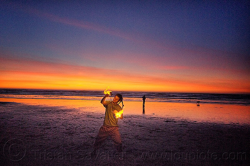 sunset fire dancing on ocean beach, dog, fire dancer, fire dancing, fire performer, fire poi, fire spinning, man, nicky evers, night, ocean beach, sea, spinning fire, sunset