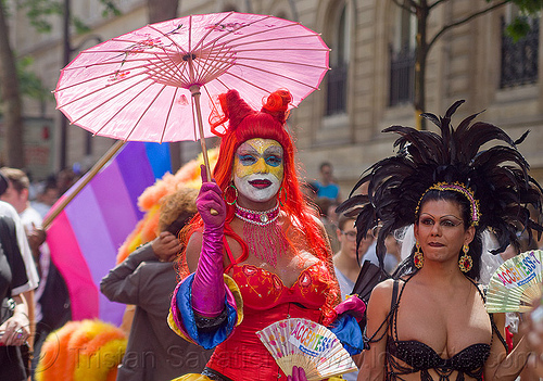 transgenders at paris gay pride march, black feathers, facepaint, feather headdress, gay pride, japanese umbrella, m2f, transgenders, transsexuals, transwoman, transwomen
