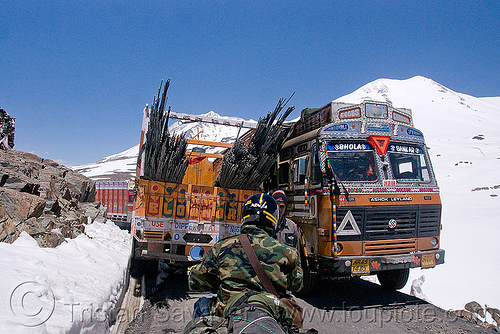trucks crossing - manali to leh road (india), baralacha pass, baralachala, ladakh, motorcycle touring, mountain pass, mountains, road, royal enfield bullet, snow, trucks