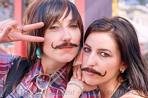 two girls with false moustaches, fake moustaches, fake mustaches, false moustaches, false mustaches, haight street fair, mustache, sarah, women