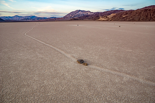 two sailing stones os a collision course - racetrack - death valley, cracked mud, death valley, dry lake, dry mud, landscape, mountains, racetrack playa, sailing stones, sliding rocks