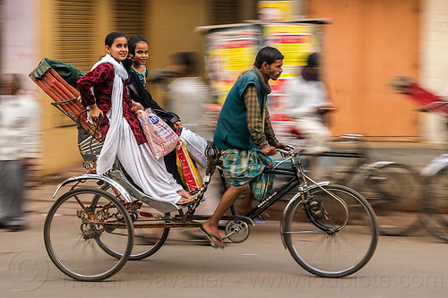 two young women on cycle rickshaw (india), bags, cycle rickshaw, man, moving, varanasi, women