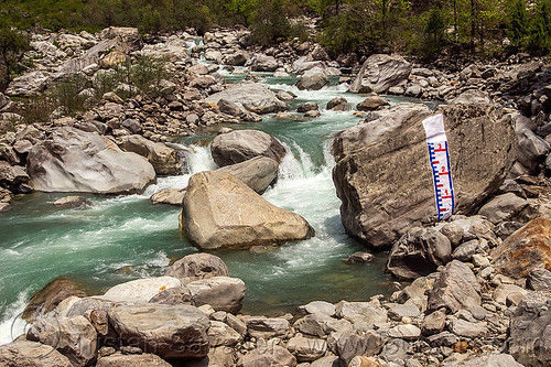 water level "staff gauge" painted on huge boulder in mountain stream (india), alaknanda river, alaknanda valley, flowing, hydrometric, mountain river, mountains, painted, staff gauge, water level, whitewater