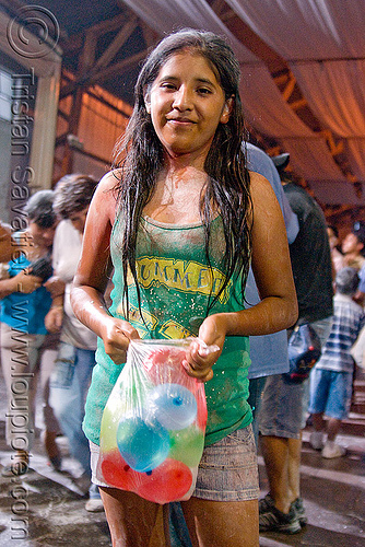 woman holding water balloons for carnival - jujuy capital (argentina), andean carnival, argentina, carnaval de la quebrada, child, jujuy capital, kid, little girl, noroeste argentino, san salvador de jujuy, water balloons