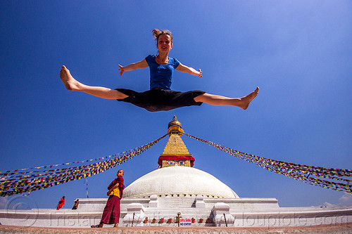 woman jumping over bodnath stupa - boudhanath (nepal), anne-laure, bodnath stupa, boudhanath, buddhism, buddhist monk, jump, jumpshot, kathmandu, man, prayer flags, spread eagle, tibetan, woman