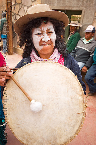 woman playing traditional andean caja drum, abra pampa, andean carnival, argentina, caja, carnaval de la quebrada, drum, drummer, drumming, folklore, gaucho, hat, music, noroeste argentino, old, quebrada de humahuaca, woman