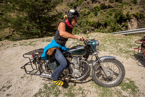woman riding royal enfield bullet motorcycle (india), alaknanda valley, kick start, kicking, kickstarting, motorcycle touring, mountains, riding, royal enfield bullet, woman