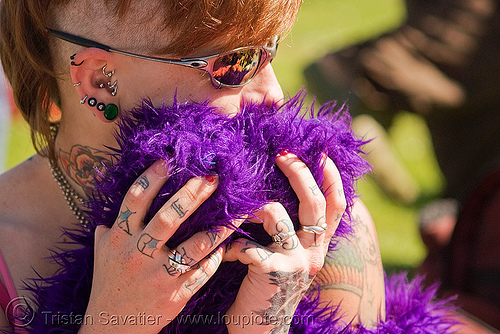 woman with ear piercings and hand tattoos - leah (san francisco), ear, fur, hands, leah, piercing, purple, sunglasses, tattooed, tattoos, woman