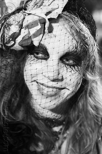woman with face veil - día de los muertos - halloween (san francisco), day of the dead, dia de los muertos, face painting, face veil, facepaint, flower headdress, flower headwear, halloween, makeup, night, woman