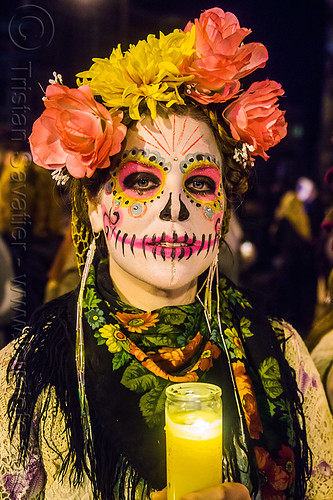 woman with pink sugar skull makeup - dia de los muertos (san francisco), candle, day of the dead, dia de los muertos, face painting, facepaint, flower headdress, flowers, halloween, night, sugar skull makeup, woman