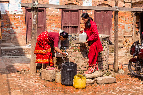 women getting water from well (nepal), bhaktapur, plastic jerrycans, plastic jugs, pouring, pulley, pulling water, ropes, water well, women