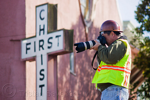 worker taking photos on construction site, camera, christ, construction worker, cros, duboce, first, high-visibility jacket, high-visibility vest, light rail, man, muni, ntk, photographer, railroad construction, railroad tracks, railway tracks, reflective jacket, reflective vest, safety helmet, safety vest, san francisco municipal railway, sign, track maintenance, track work