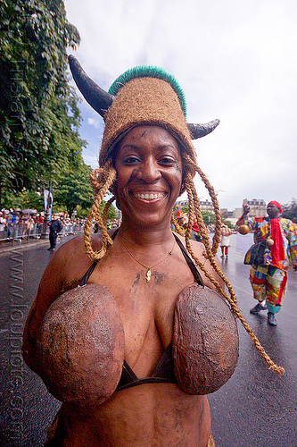 young caribbean woman wearing coconut bra - choukaj - carnaval tropical in paris, caribbean, carnaval tropical, choukaj, coconut bra, coconuts, costumes, creole, créole, guadeloupe, hat, indigenous culture, parade, traditional, tribal, west indies, woman