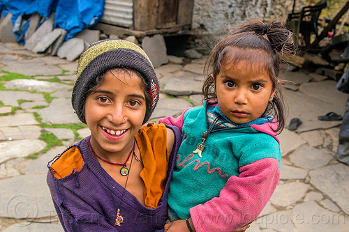 young girl holding her little sister in himalayan village (india), children, girls, janki chatti, kids, knit cap, little girl, necklaces, siblings