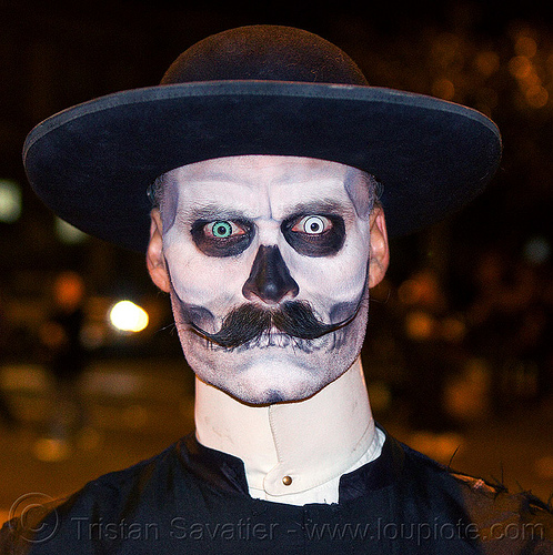zombie priest with scary eyes, black hat, blue contact lenses, blue lenses, cappello romano, cassock, clergy, clerical collar, color contact lenses, day of the dead, dia de los muertos, face painting, facepaint, halloween, man, mustache, night, pastor, priest, randal smith, saturno hat, skull makeup, special effects contact lenses, theatrical contact lenses, white contact lenses, white contacts, zombie