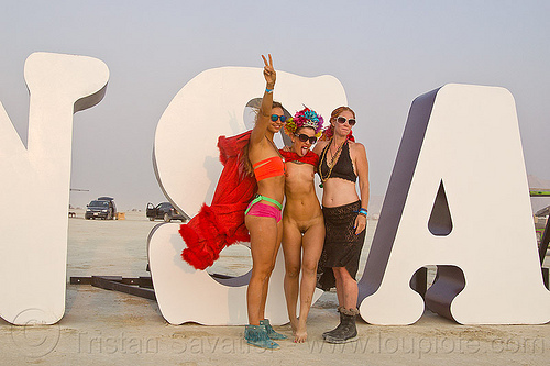 burning man - three young women posing for photo-shoot at insanity, art installation, insanity, letters, sunglasses, women