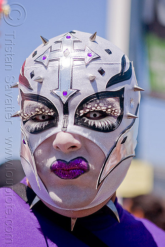 white mask with spikes, color contact lenses, color contacts, cross, feather eyelashes extensions, gay pride festival, makeup, man, mask, purple lipstick, white contact lenses, white contacts