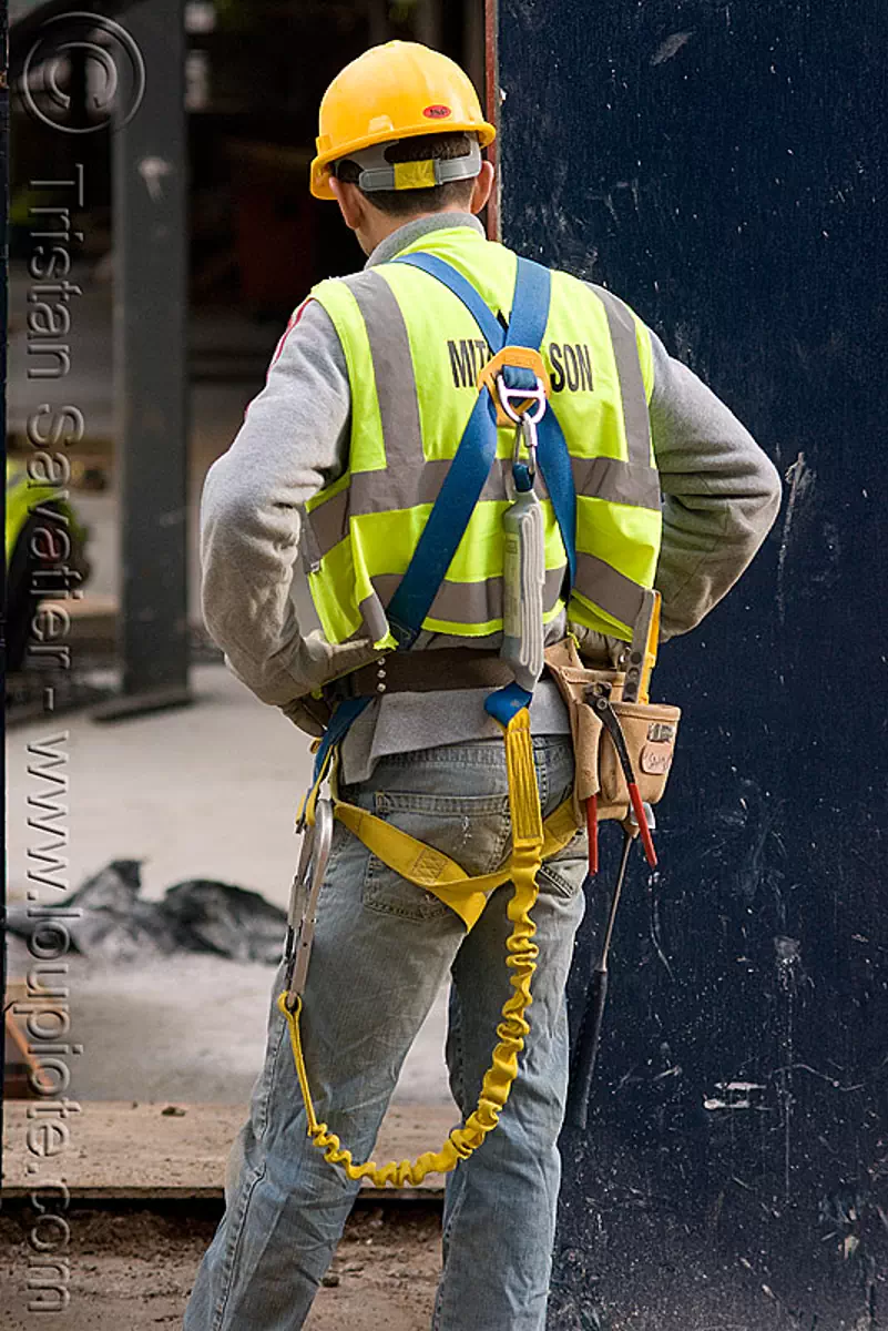 safety harness, helmet, reflective vest, construction worker