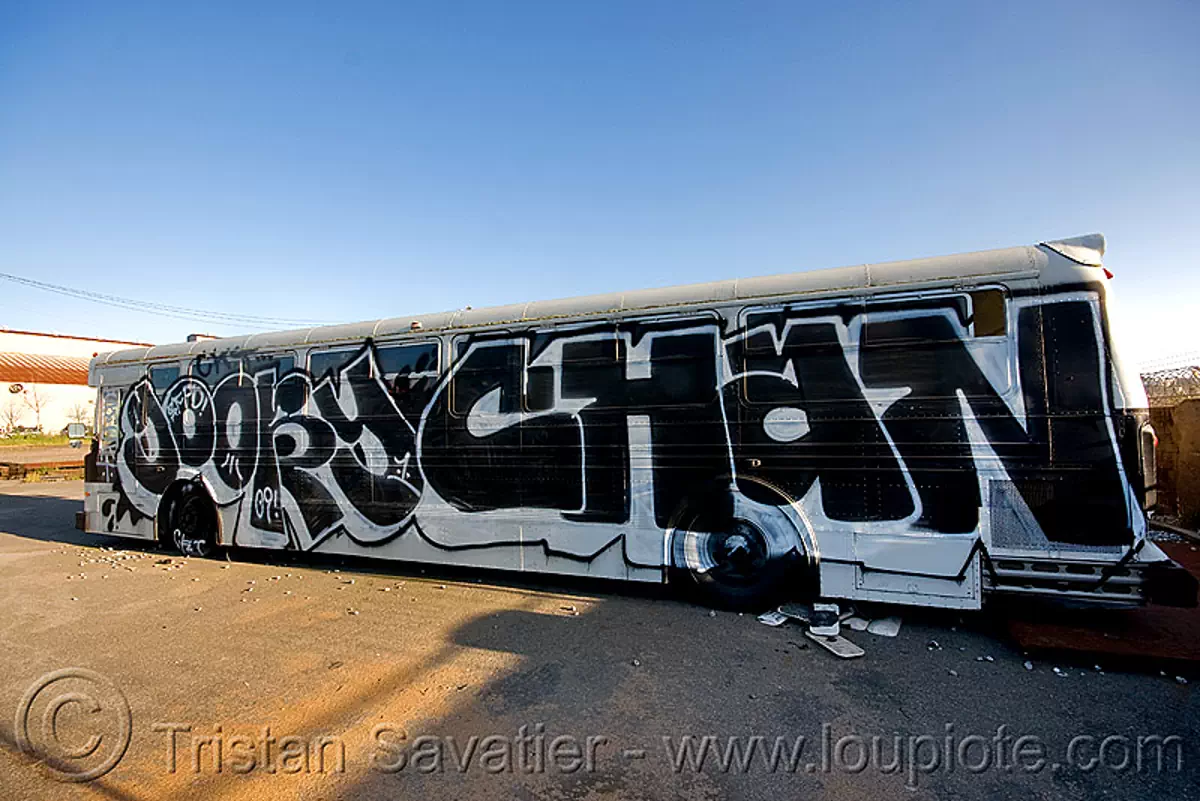 abandoned SFPD police bus with graffiti (san francisco), autobus, goory chan, gory chan, graffiti, junkyard, no trespassing, san francisco police department, sfpd bus, street art