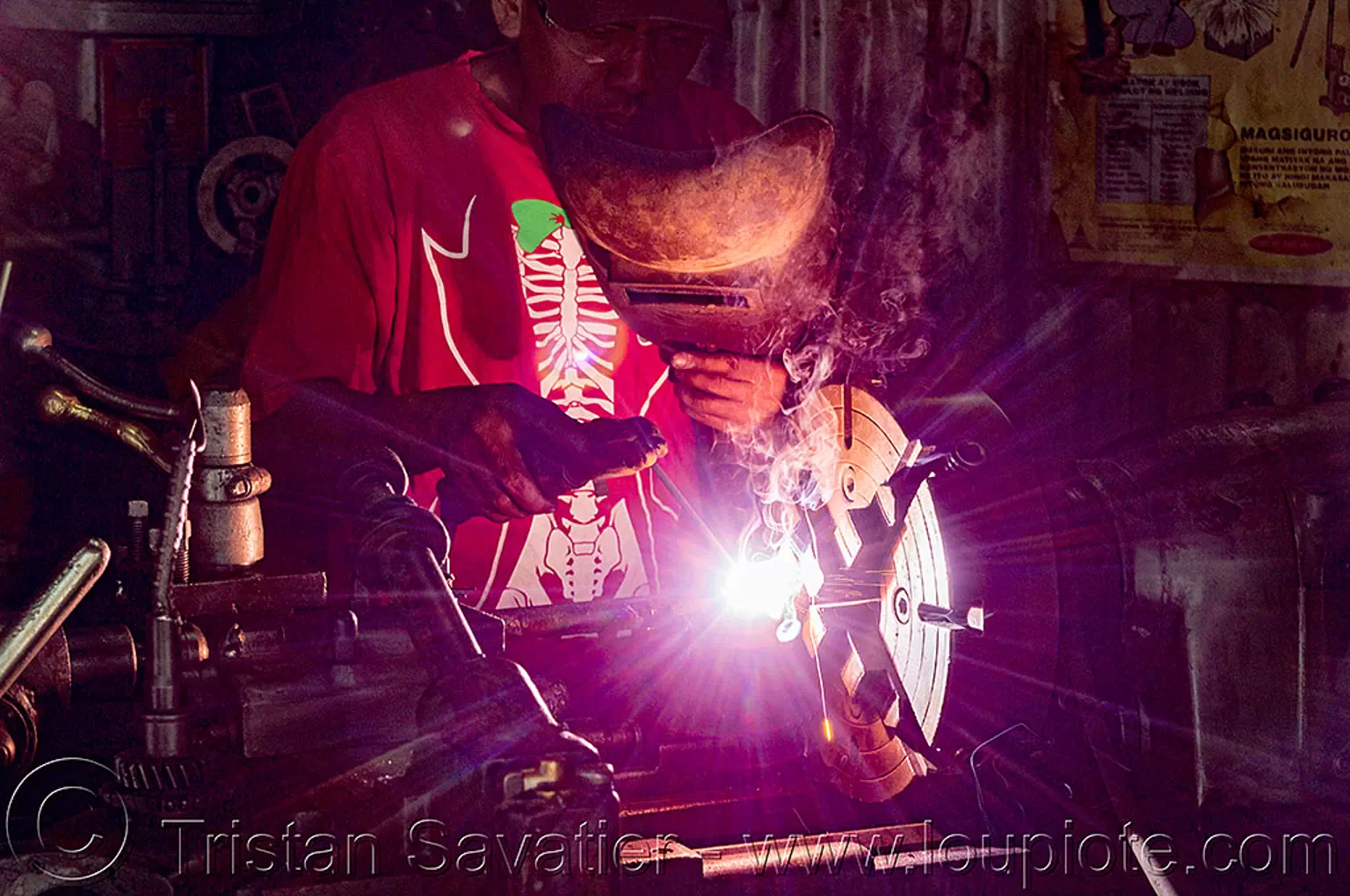 arc welding on lathe in metal workshop (philippines), arc welding, baguio, machine shop, machine tool, man, mechanical workshop, metal lathe, operator, philippines, welder, worker, working