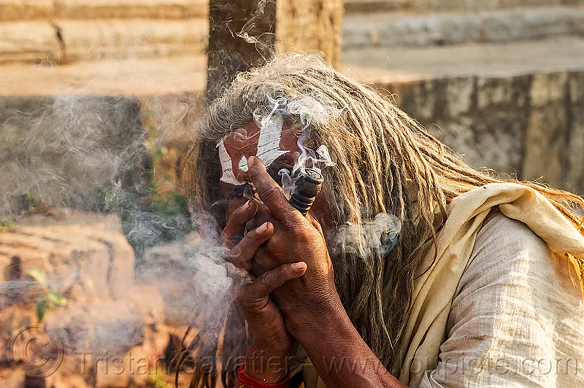 baba smoking a chillum of weed - ritual cannabis (nepal), baba smoking chillum, dreadlocks, ganja, hindu, hinduism, kathmandu, maha shivaratri, man, pashupatinath, sadhu, smoke, smoking pipe, smoking weed, tilak, tilaka