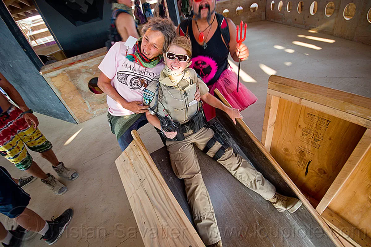 BLM police officer on slide, burning man 2013