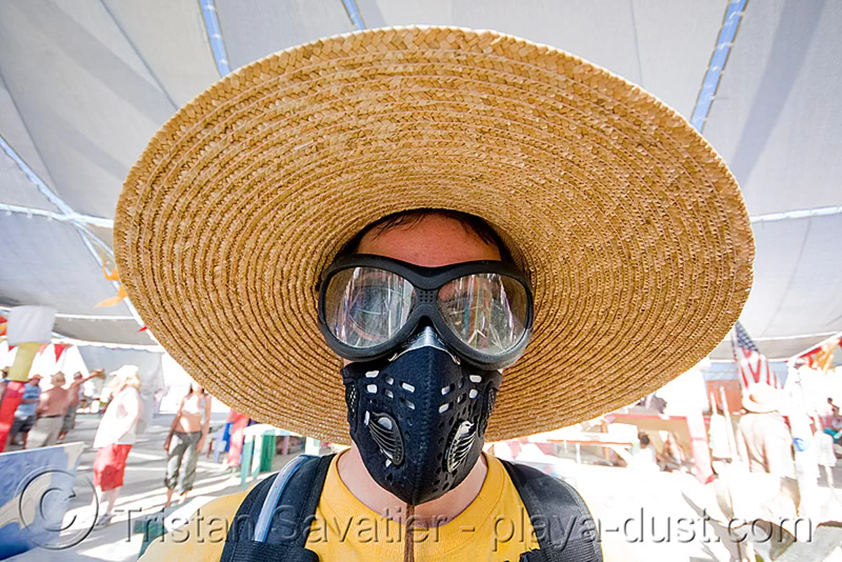 burner with straw hat and dust mask, respirator, burning man 2008