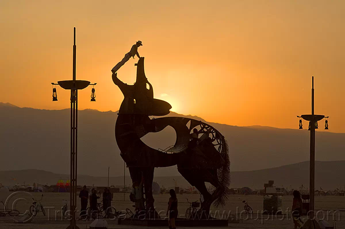 burning man - coyote sculpture by bryan tedrick, art installation, bryan tedrick, climbers, climbing, coyote sculpture, dusk, metal sculpture, statue, sunset
