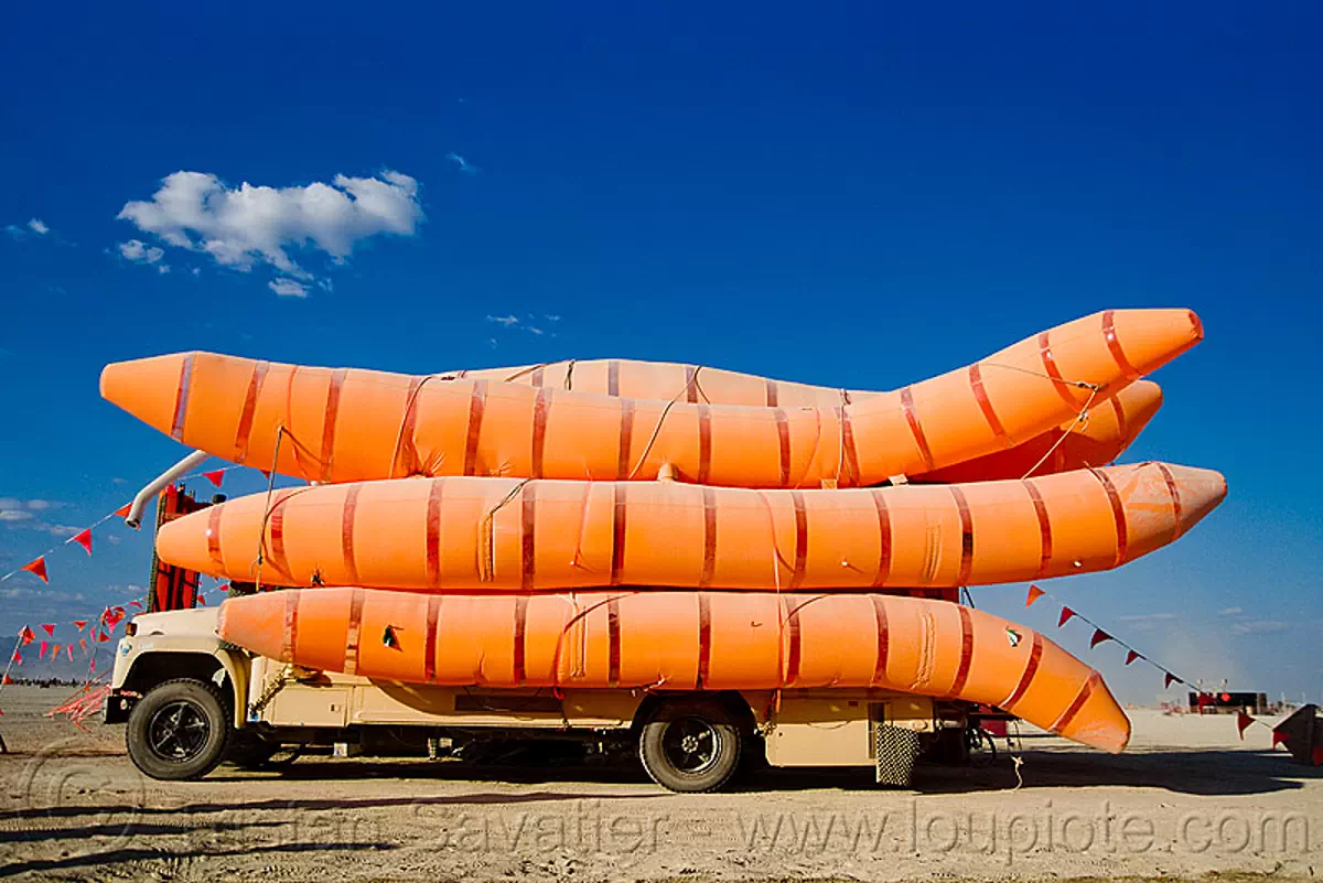 burning man - disorient - giant worms art car, akairways, art car, art installation, burning man art cars, disorient, inflatable art, maggots, mutant vehicles, orange, worms