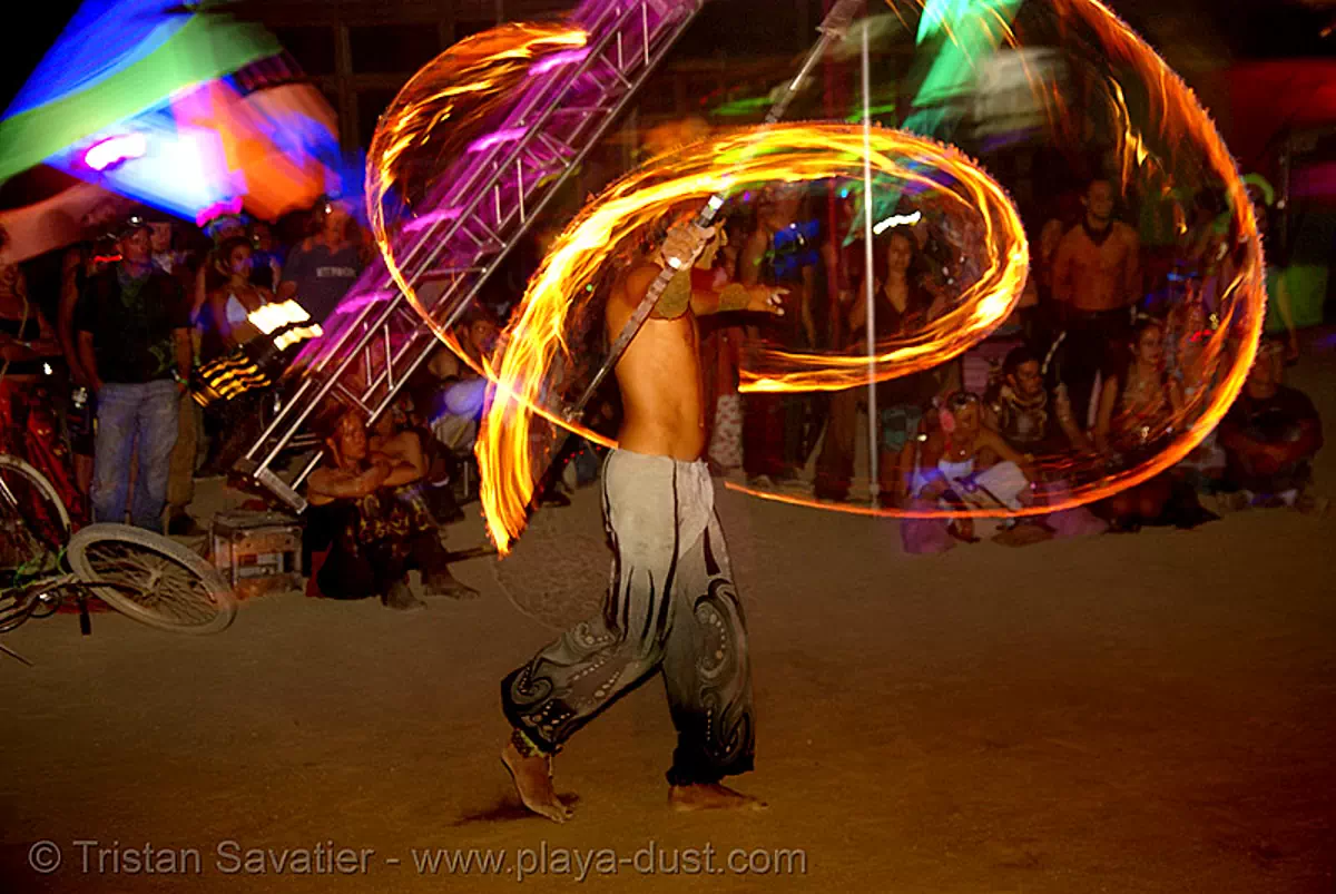 burning man - keith aka srikanta spinning a fire staff, burning man at night, fire dancer, fire dancing, fire performer, fire spinning, keith, spinning fire, srikant, srikanta