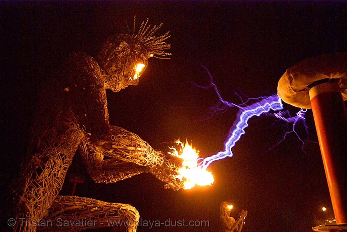 burning man - tesla coil and neela, burning man at night, electric arc, electric discharge, fire, high voltage, lightnings, plasma filaments, sculpture, static electricity, tesla coil