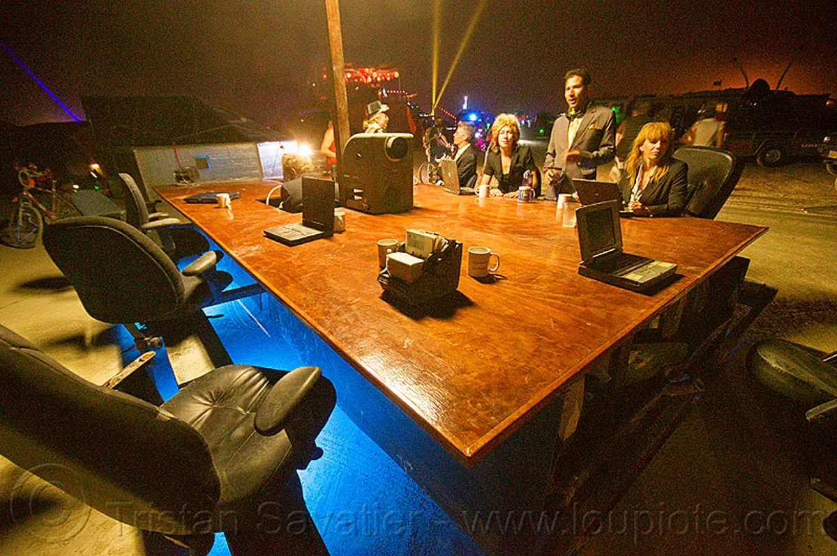 burning man - the board room aka driven by profit, art car, burning man art cars, burning man at night, chairs, conference room, mutant vehicles, office, sitting, table