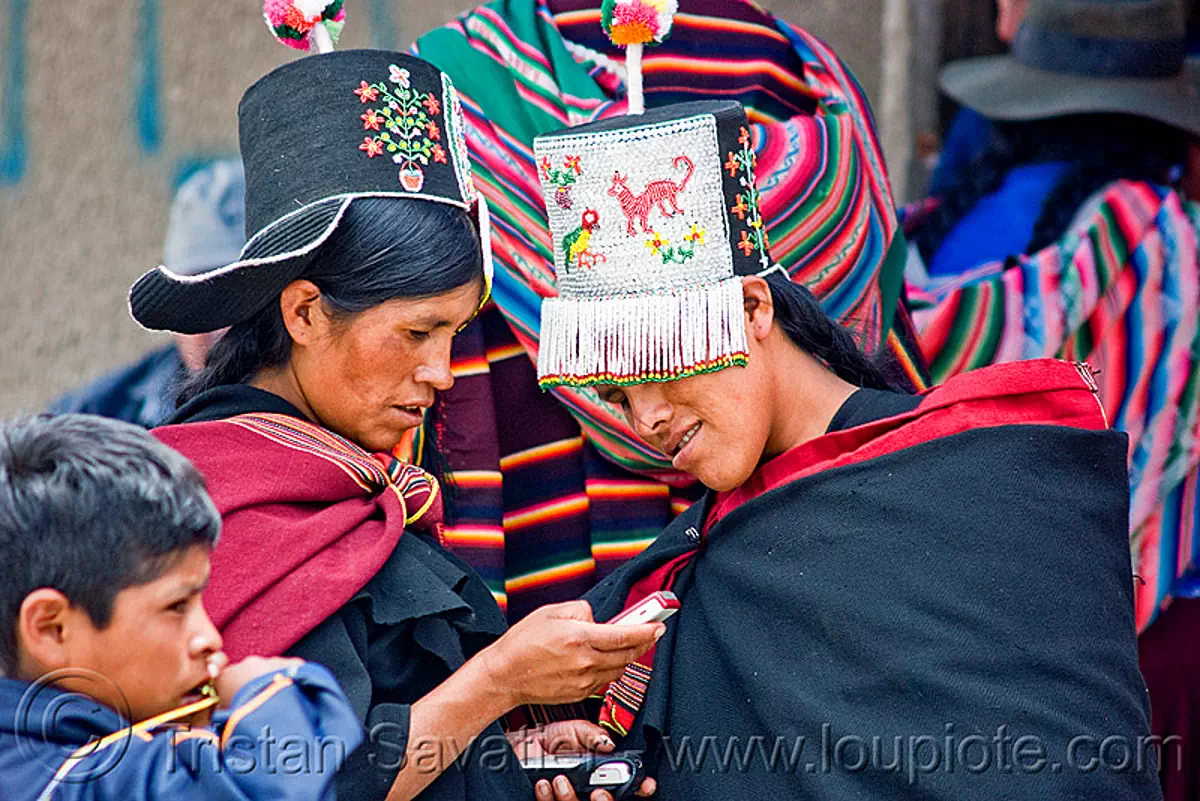 cellphone used by tribe women, bolivia, cellphones, hats, headdress, indigenous, phones, quechua, tarabuco, technology, traditional, tribal, tribe, women