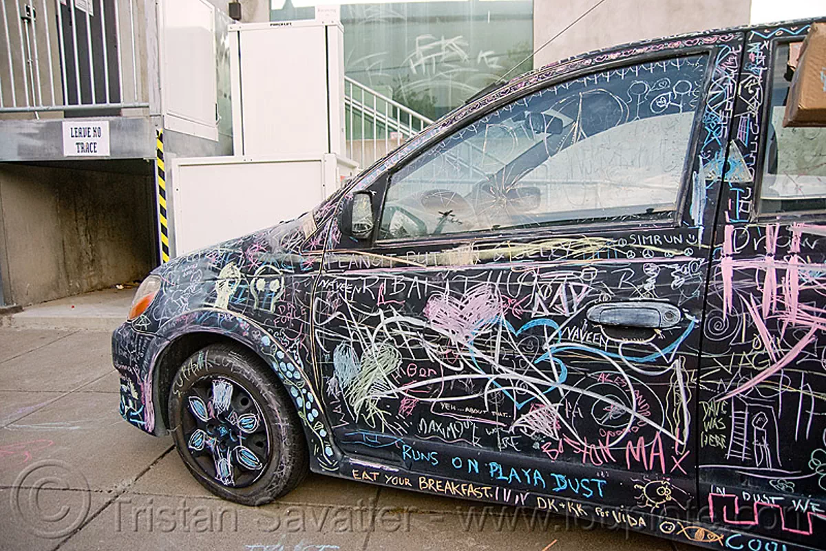 chalk writing on car - burning man decompression 2009 (san francisco), black car, chalk writing, graffiti, vandalism