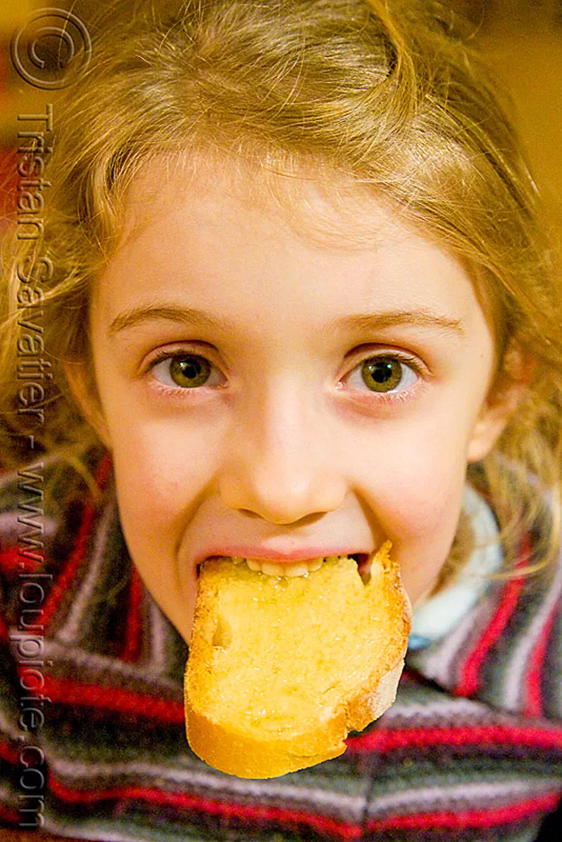 child eating toasted bread