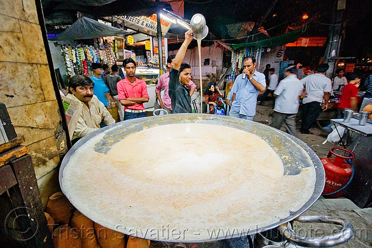 cooked milk street vendor - delhi (india), cooked milk, delhi, garam doodh, india, night, paharganj, pouring, street seller, vessel