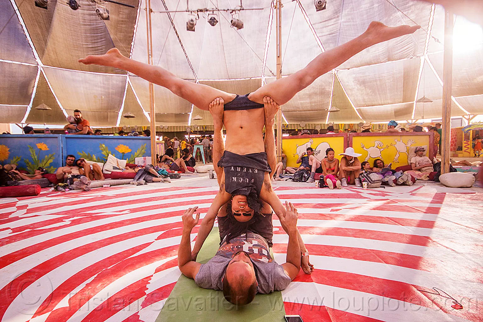 couple doing acro-yoga - burning man 2015, acro-yoga, azami, burning man, leg spread, legs spread, splits, spread eagle, upside down, woman