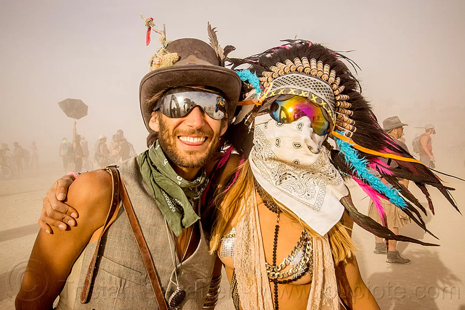 couple during white out - burning man 2015, bandana, burning man, dust storm, face mask, feather headdress, feathers, mathieu, mirror sunglasses, pia, white out, windy, woman