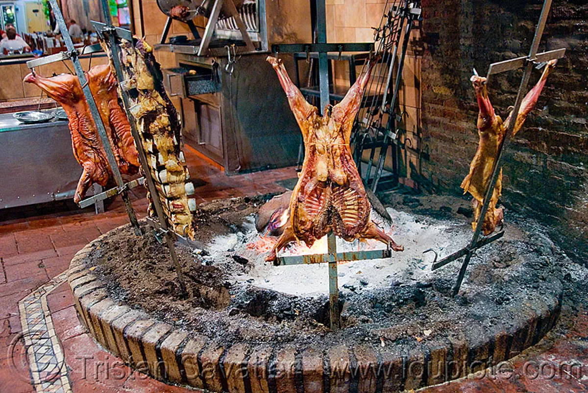 crucified lamb barbecue roasting in restaurant, buenos aires