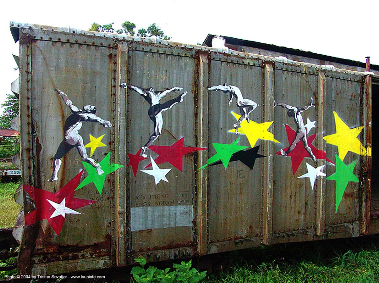 dancing-stars - painting on train car - semi-abandoned train yard in puerto limon (costa rica), atlantic railway, costa rica, freight train car, paint, painted, puerto limon, rusty, stars, train depot, train yard, trespassing