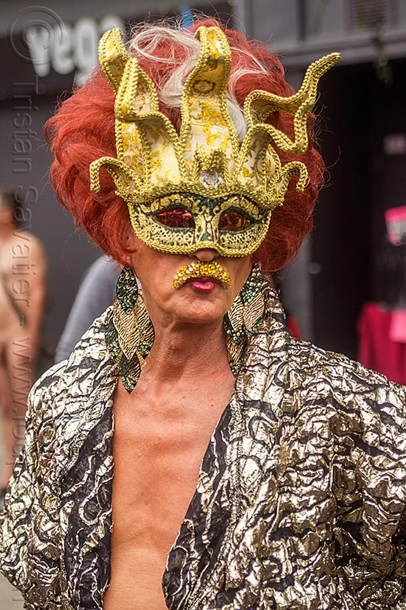 drag queen with golden carnival mask
