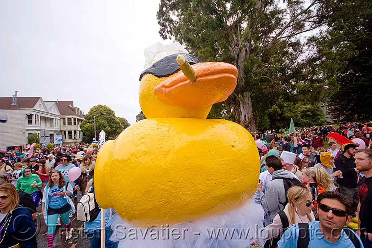 ducky float - bay to breaker footrace and street party (san francisco), bay to breakers, carnival float, cigar smoking, costume, crowd, footrace, giant ducky, street party, yellow